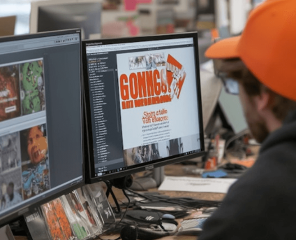 Man analyzing digital marketing trends across multiple computer screens.